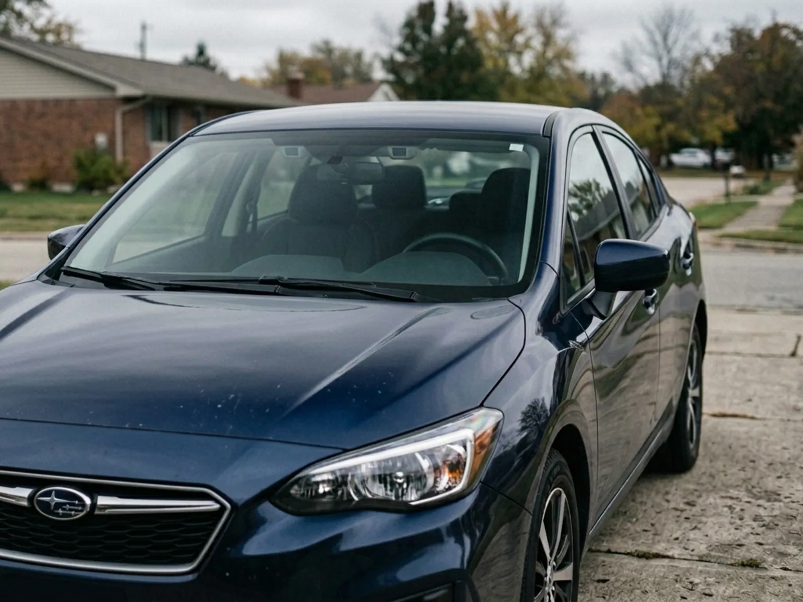 A vehicle after windshield replacement, the glass clean and undamaged.
